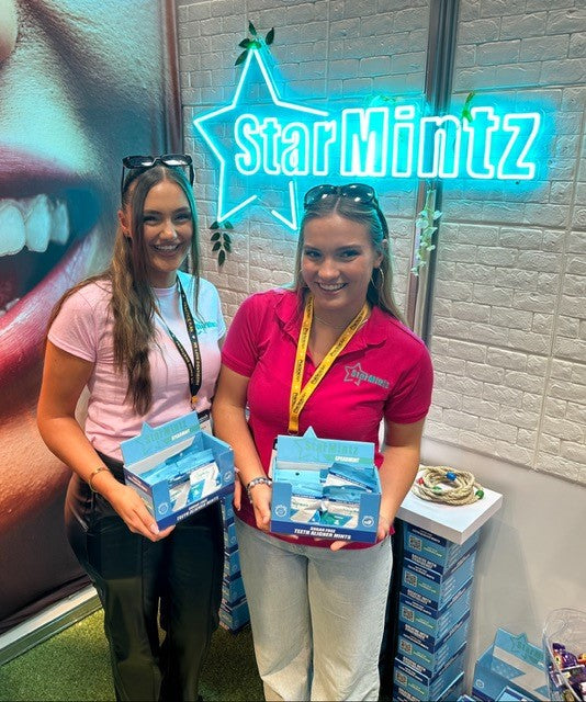 StarMintz girls offering free samples of clear alginer mints at the BDA expo Birmingham.